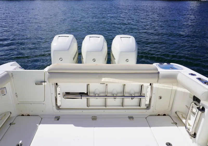 Slide: The Image of 2020 Boston Whaler 350 Outrage boat with triple outboard engines. - 15