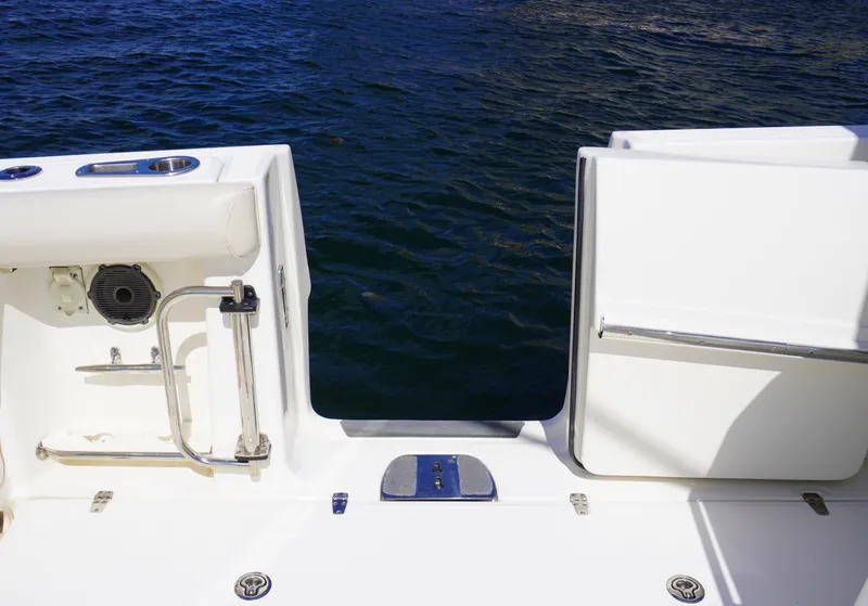 Slide: The Image of Boston Whaler 350 Outrage 2020 boat stern view with open transom door. - 16