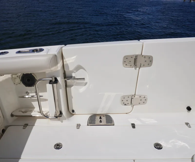Slide: The Image of Boston Whaler 350 Outrage 2020 boat deck with stainless steel fixtures and ocean view. - 17