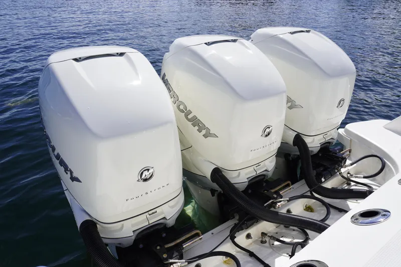 Slide: The Image of Triple Mercury outboard engines on a 2020 Boston Whaler 350 Outrage boat. - 19