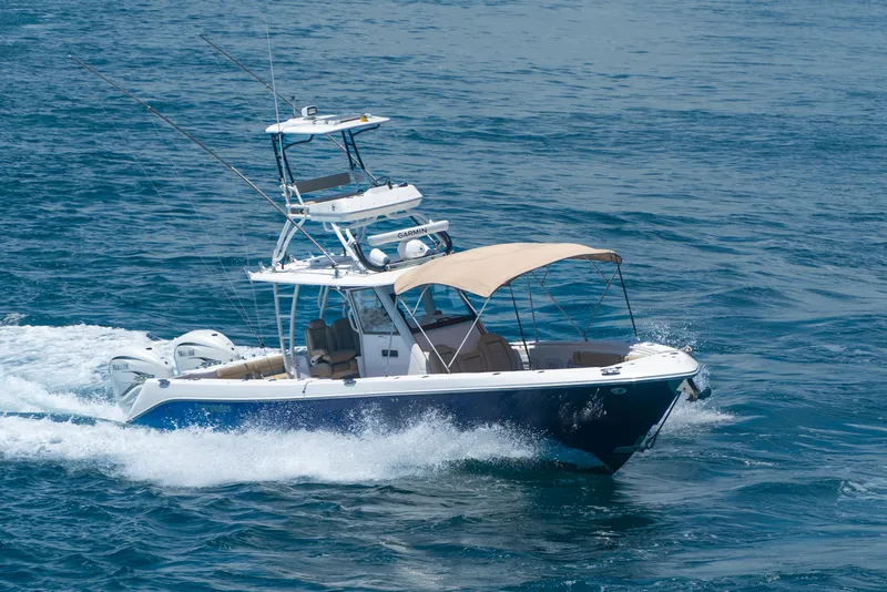 Slide: The Image of 2019 Everglades 355 Center Console boat cruising on the ocean. - 1