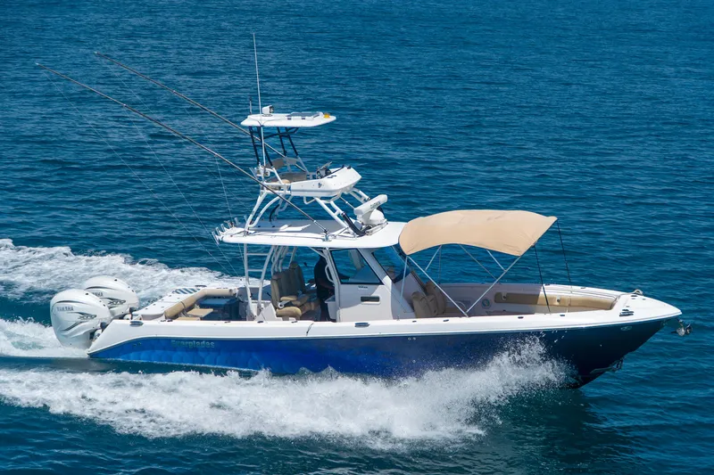 Slide: The Image of 2019 Everglades 355 Center Console boat cruising on the ocean. - 5