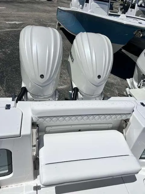 Slide: The Image of 2025 Sportsman 282 Open boat with twin outboard engines. - 11