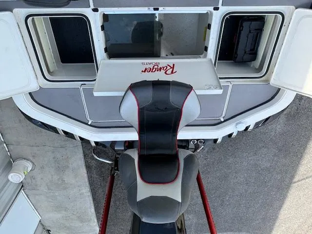 Slide: The Image of 2016 Ranger Z520C boat interior with storage compartments and seat. - 12