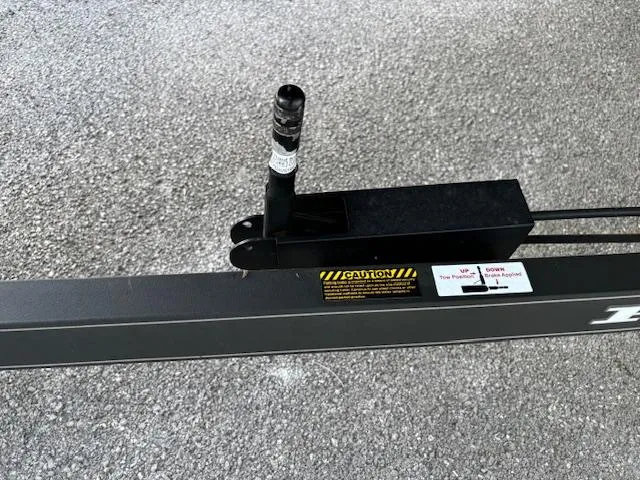 Slide: The Image of 2016 Ranger Z520C trailer hitch with caution label and locking mechanism. - 5