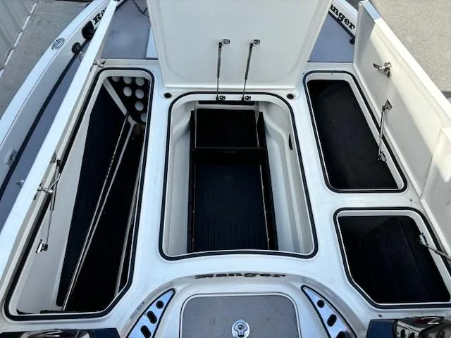 Slide: The Image of 2016 Ranger Z520C boat storage compartments open, showcasing ample storage space. - 7