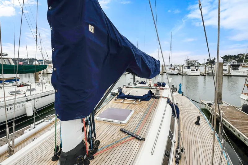 Slide: The Image of Nautor Swan 48 sailboat, 2001 model, docked at a marina with clear blue skies. - 10