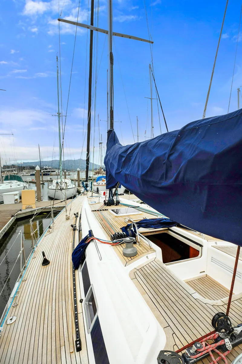 Slide: The Image of Nautor Swan 48 sailboat, 2001 model, docked at marina with blue sky background. - 14