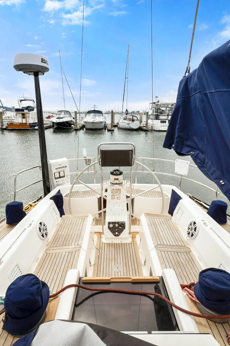 Slide: The Image of Nautor Swan 48 sailboat, 2001 model, docked at a marina with clear blue skies. - 17