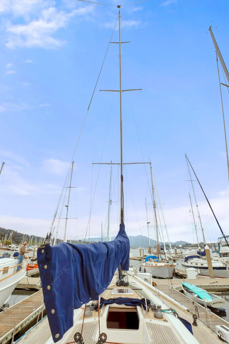 Slide: The Image of Sailboat Nautor Swan 48 (2001) docked at marina with blue sky background. - 20