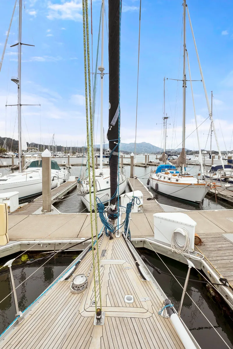 Slide: The Image of Bow view of 2001 Nautor Swan 48 yacht docked at marina. - 22