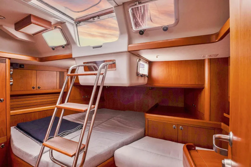 Slide: The Image of Luxurious cabin interior of 2001 Nautor Swan 48 yacht with wooden finish and skylight. - 29