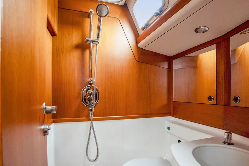 Slide: The Image of 2001 Nautor Swan 48 yacht bathroom with wooden finish and modern shower. - 31
