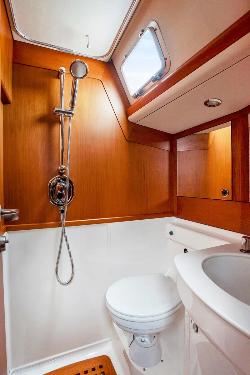 Slide: The Image of 2001 Nautor Swan 48 yacht bathroom with shower, toilet, and sink. - 32