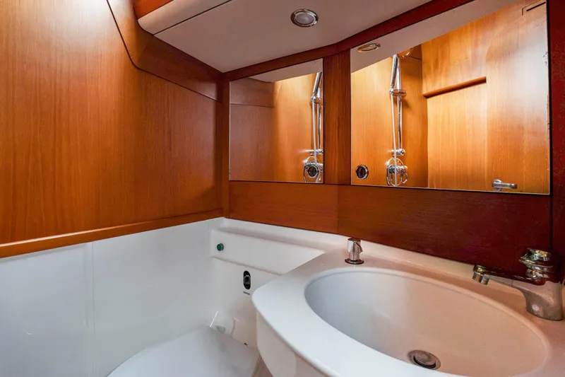 Slide: The Image of Bathroom interior of 2001 Nautor Swan 48 yacht with wooden cabinetry and modern fixtures. - 33
