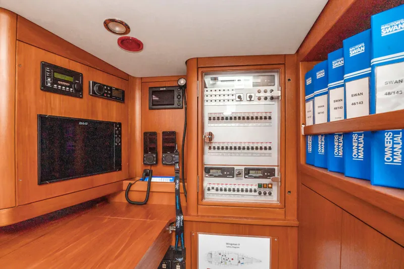 Slide: The Image of Navigation and control panel of a 2001 Nautor Swan 48 yacht with manuals. - 43
