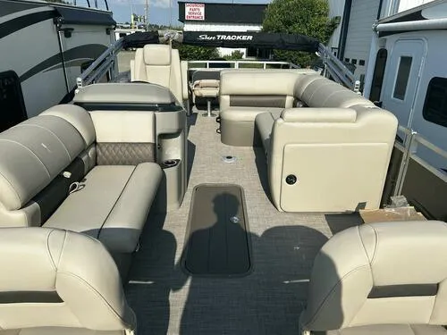 Slide: The Image of 2025 Sun Tracker Fishin' Barge 22 XP3 interior with spacious seating and modern design. - 5