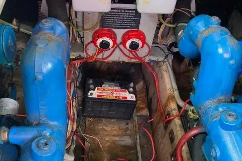 Slide: The Image of Engine compartment of a 1986 Silverton 37 Convertible with battery and wiring. - 17