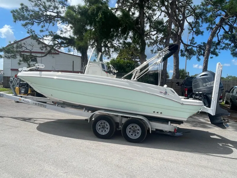 Slide: The Image of 2020 Stingray 206 CC boat on a trailer with Yamaha outboard motor. - 1