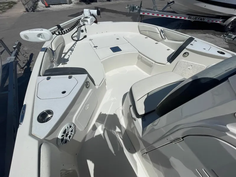 Slide: The Image of 2020 Stingray 206 CC boat interior with seating and control panel. - 4