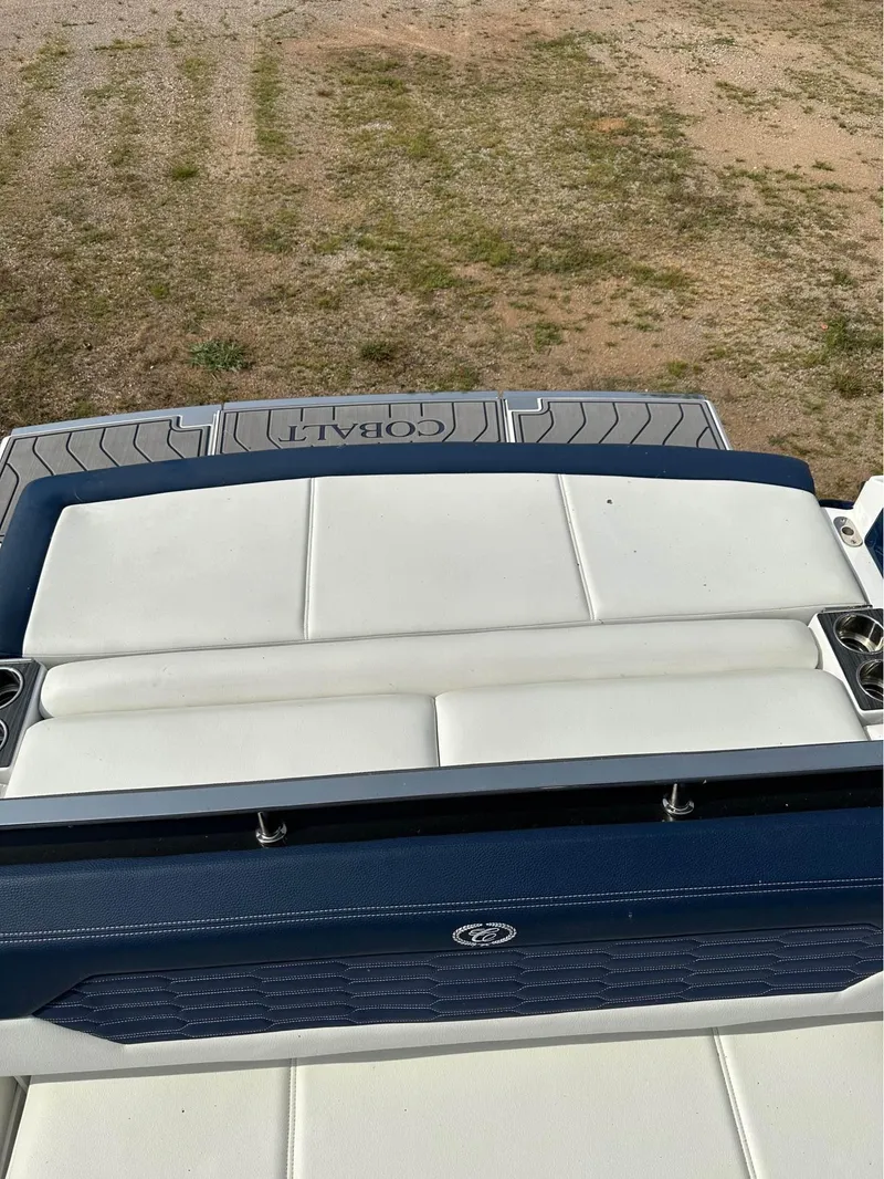 Slide: The Image of 2022 Cobalt A29 boat with white and blue seating. - 10