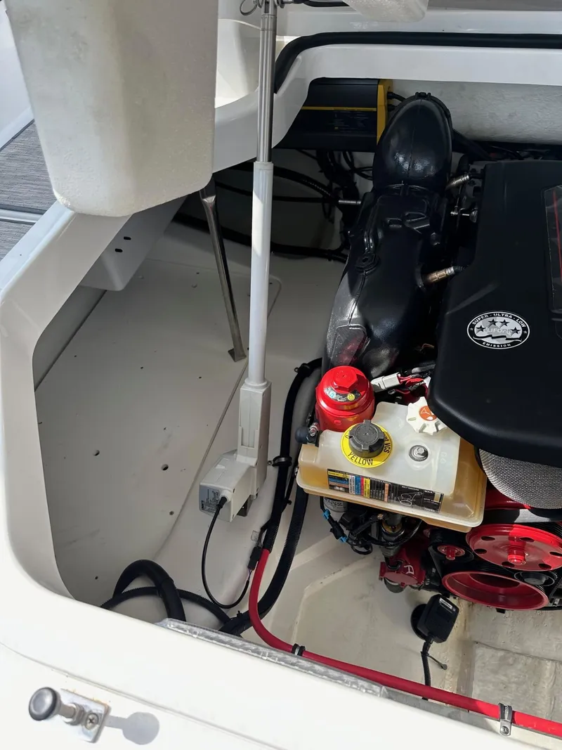 Slide: The Image of Engine compartment of a 2022 Cobalt A29 boat showing engine and components. - 14