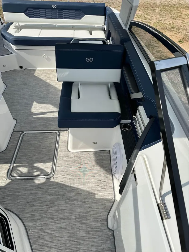 Slide: The Image of 2022 Cobalt A29 boat interior with blue and white seating and modern design. - 3