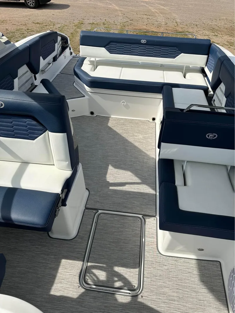 Slide: The Image of 2022 Cobalt A29 boat interior with blue and white seating. - 4