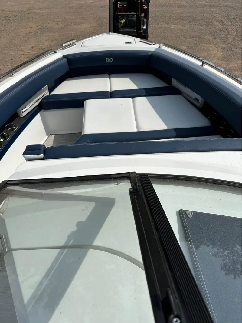 Slide: The Image of 2022 Cobalt A29 boat with white and blue seating. - 5