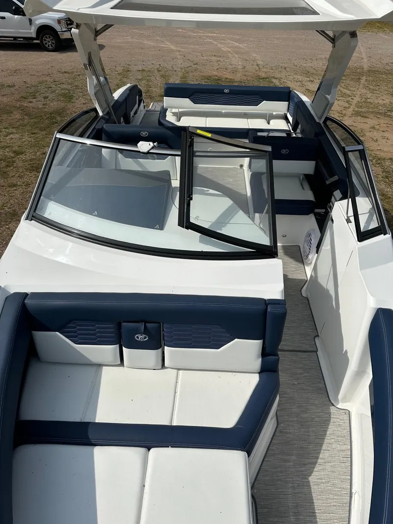 Slide: The Image of 2022 Cobalt A29 boat interior with blue and white seating. - 8