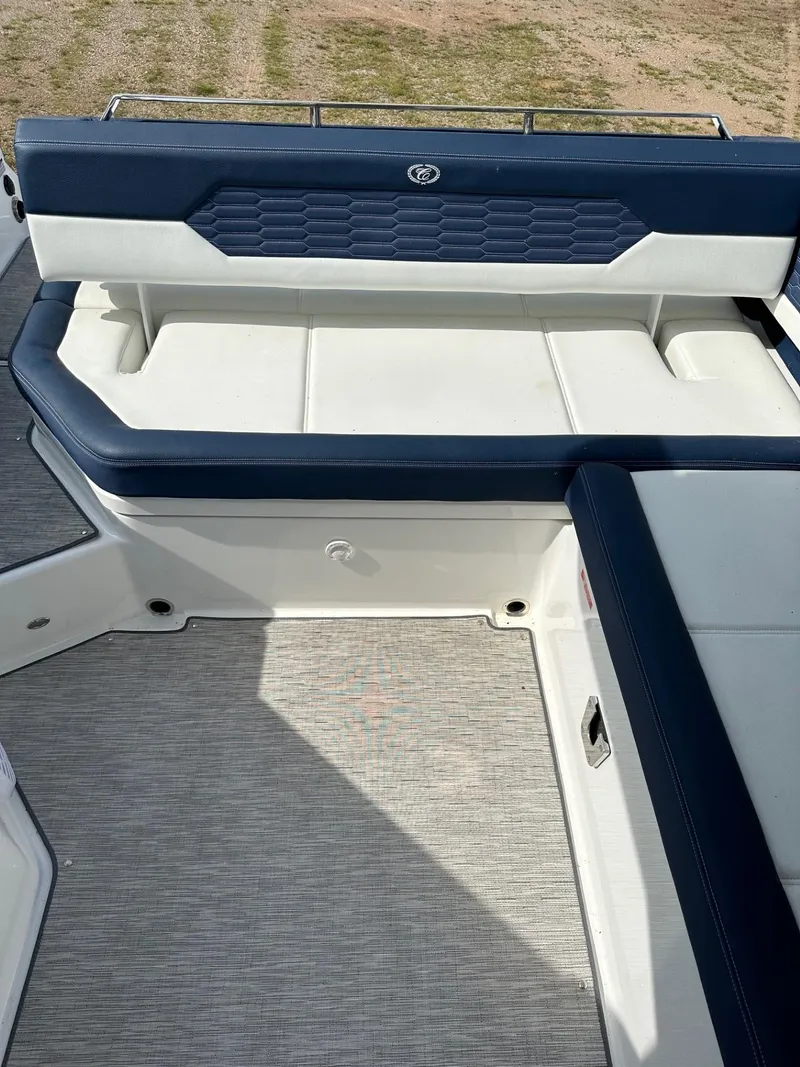 Slide: The Image of 2022 Cobalt A29 boat interior with blue and white seating. - 9