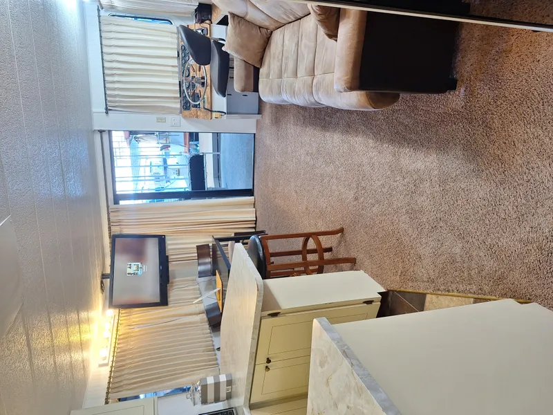 Slide: The Image of Interior of a 1986 Skipperliner houseboat with cozy living area and modern amenities. - 21