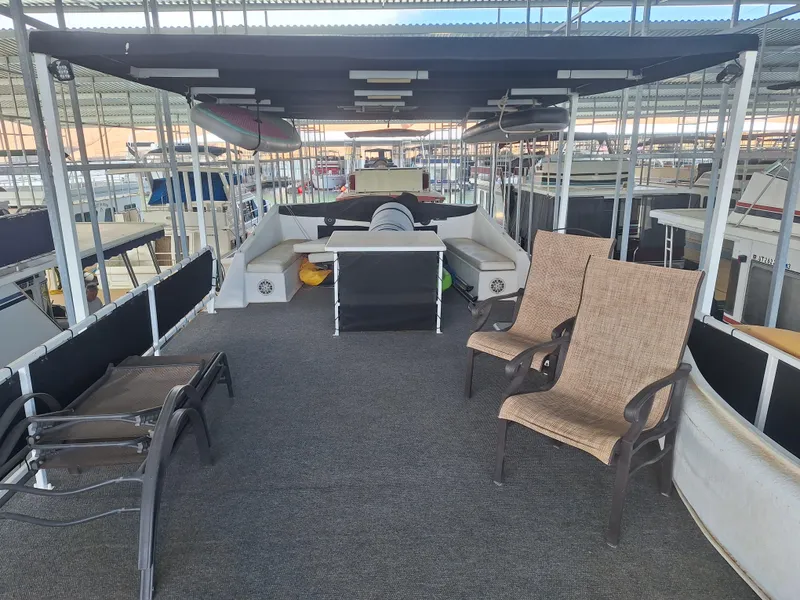 Slide: The Image of 1986 Skipperliner Houseboat upper deck with seating area and canopy. - 4