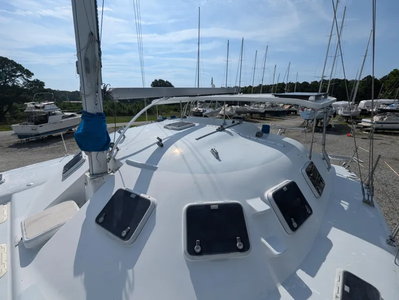 Slide: The Image of 1998 Shuttleworth Ocean Cheetah 37 catamaran on land, showcasing deck and hatches. - 10