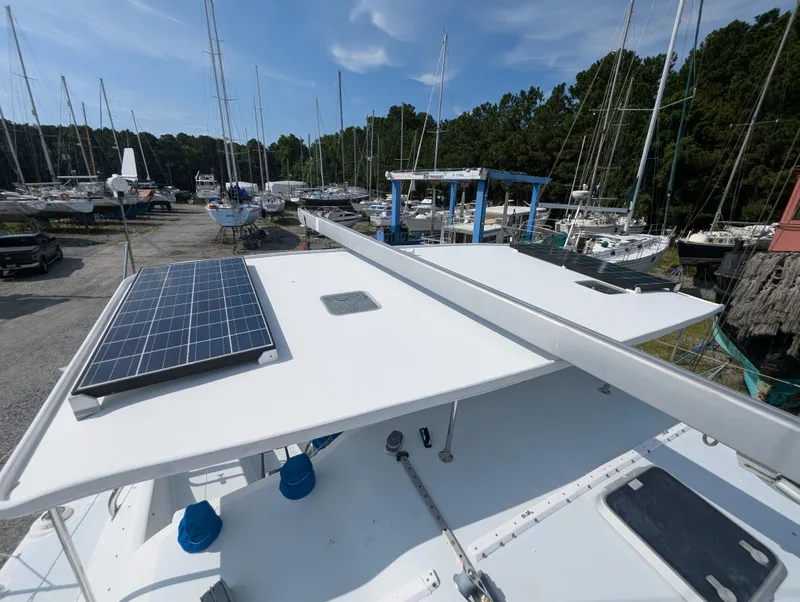 Slide: The Image of Shuttleworth Ocean Cheetah 37 catamaran with solar panels, docked in a marina, 1998 model. - 14