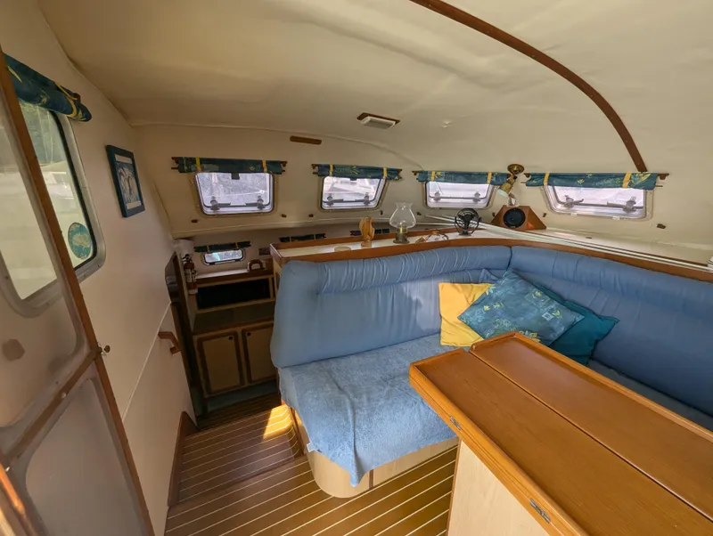 Slide: The Image of Interior of 1998 Shuttleworth Ocean Cheetah 37, featuring cozy seating and nautical decor. - 21