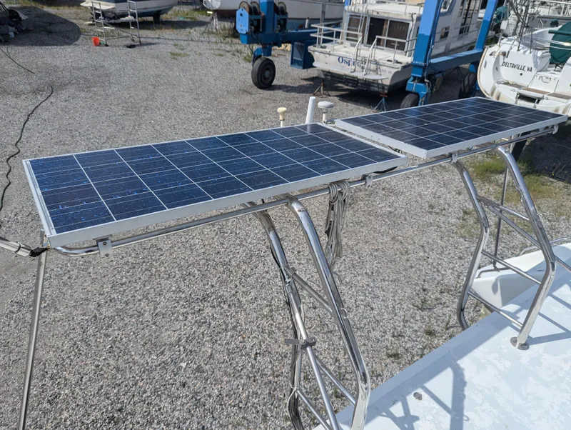 Slide: The Image of Solar panels on Shuttleworth Ocean Cheetah 37 catamaran, 1998 model, in a boatyard setting. - 35