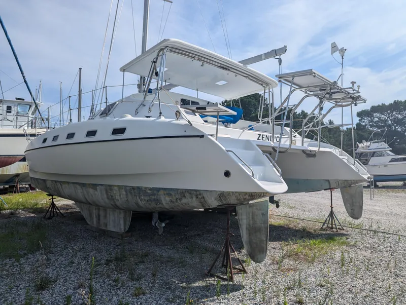 Slide: The Image of Shuttleworth Ocean Cheetah 37 catamaran, 1998 model, on dry dock with clear sky background. - 4