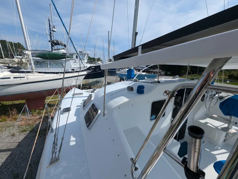 Slide: The Image of Shuttleworth Ocean Cheetah 37 sailboat, 1998 model, docked with other boats in a marina. - 7