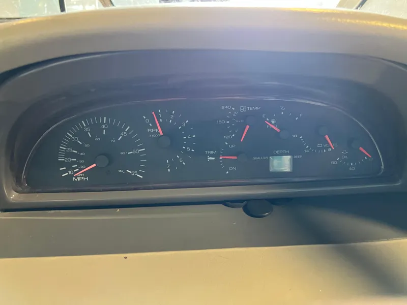 Slide: The Image of 1997 Four Winns 258 Vista boat dashboard with speedometer and gauges. - 20