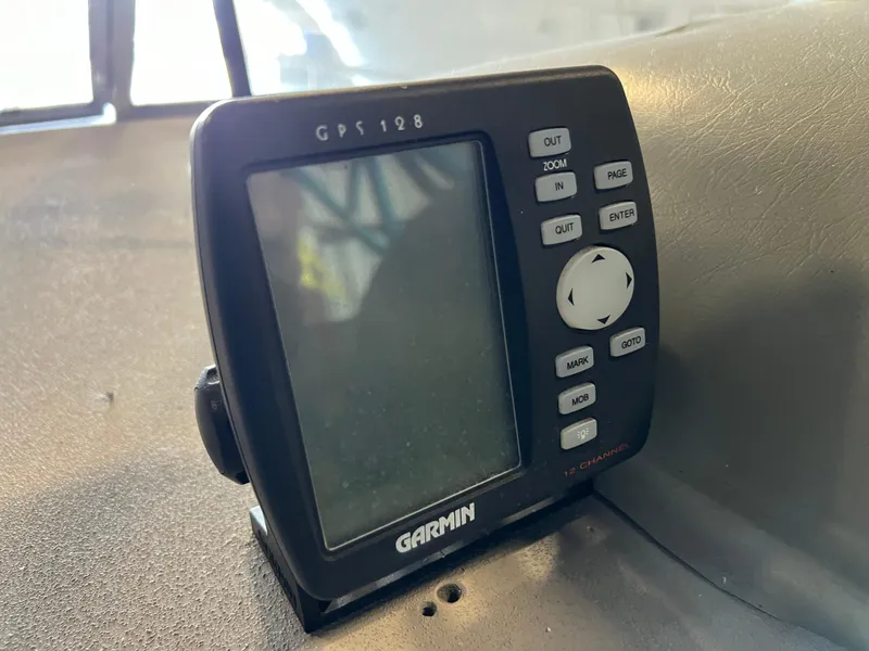Slide: The Image of Garmin GPS 128 on 1997 Four Winns 258 Vista boat dashboard. - 21