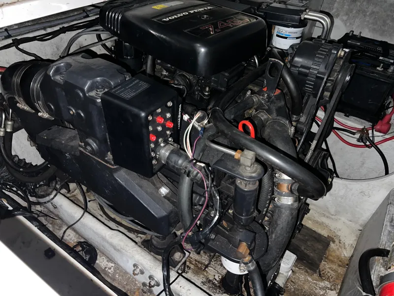 Slide: The Image of 1997 Four Winns 258 Vista engine compartment with visible wiring and components. - 33