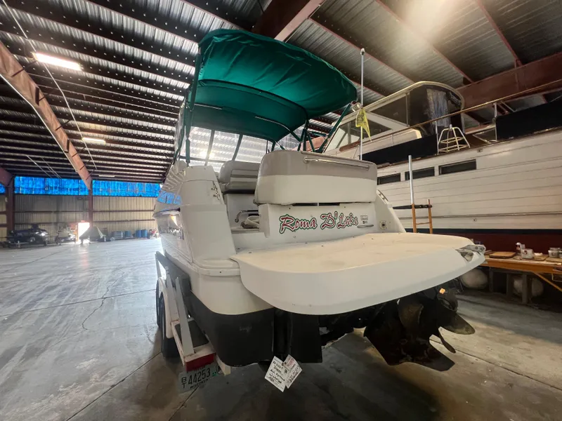 Slide: The Image of 1997 Four Winns 258 Vista boat in indoor storage. - 4