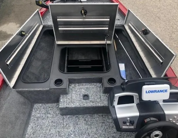 Slide: The Image of 2025 Tracker Pro Team 175 TXW fishing boat interior with storage compartments open. - 10