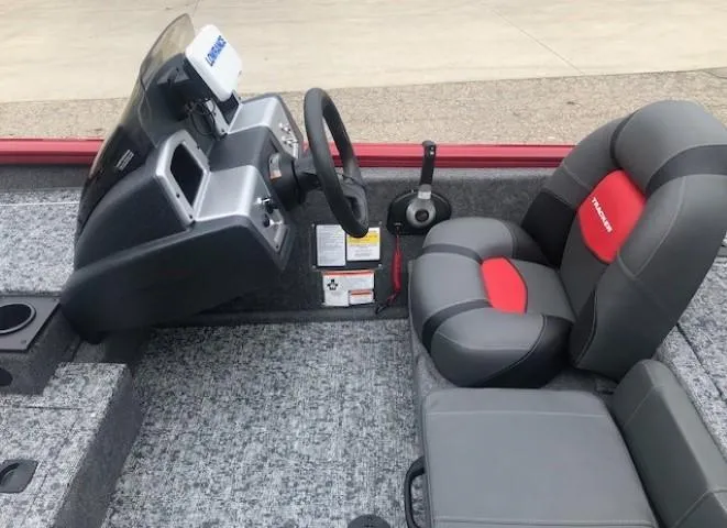 Slide: The Image of 2025 Tracker Pro Team 175 TXW boat interior with steering wheel and seats. - 17