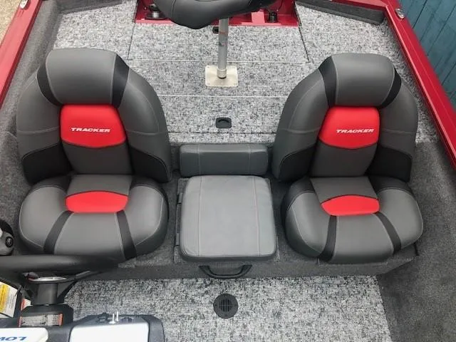 Slide: The Image of 2025 Tracker Pro Team 175 TXW boat interior with dual seats and gray carpet. - 20