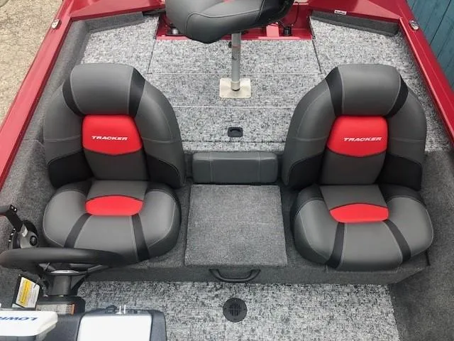 Slide: The Image of 2025 Tracker Pro Team 175 TXW boat interior with two black and red seats. - 21