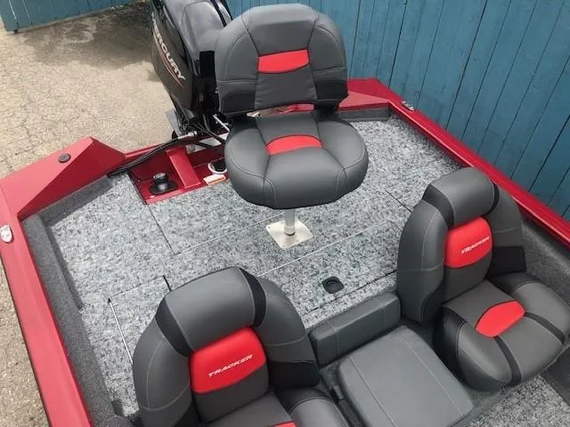 Slide: The Image of 2025 Tracker Pro Team 175 TXW boat interior with gray and red seats. - 23