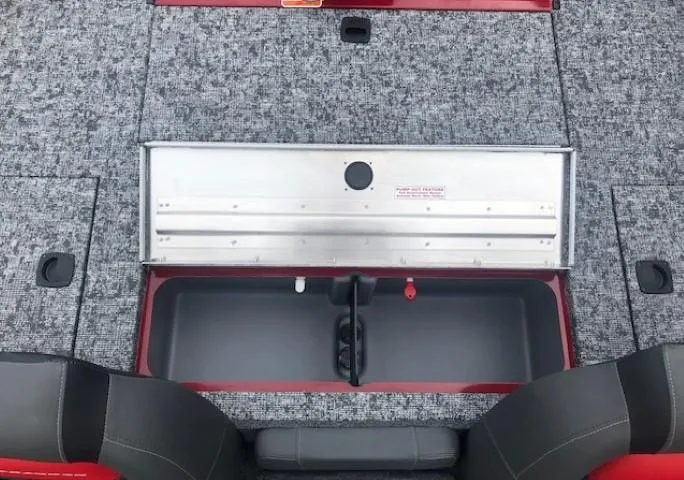 Slide: The Image of 2025 Tracker Pro Team 175 TXW boat storage compartment with gray carpet. - 25