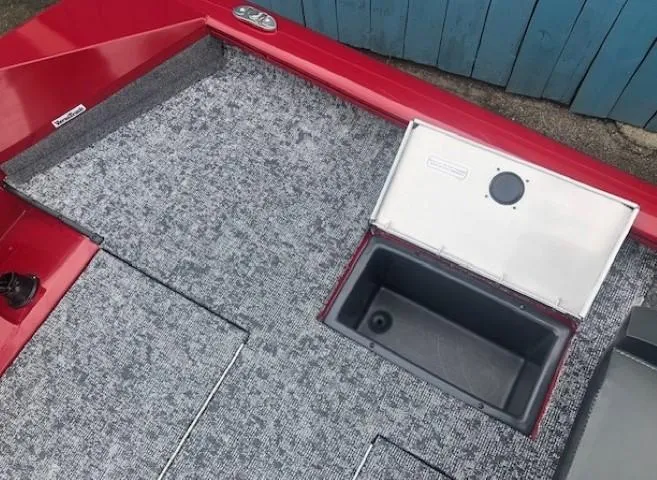 Slide: The Image of 2025 Tracker Pro Team 175 TXW boat interior with storage compartment. - 26